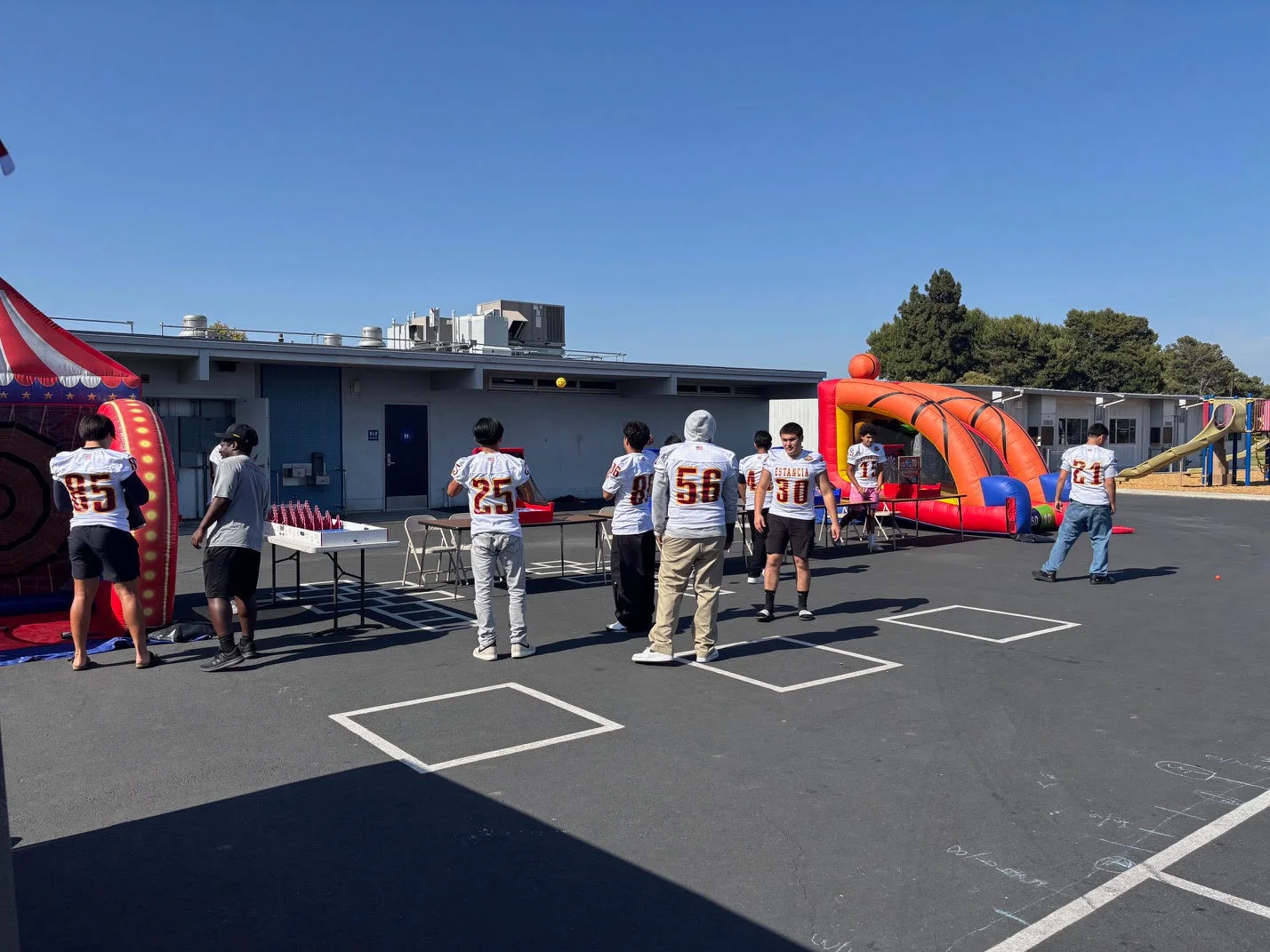 Estancia Footall Setting up Games at Adams El Carnival